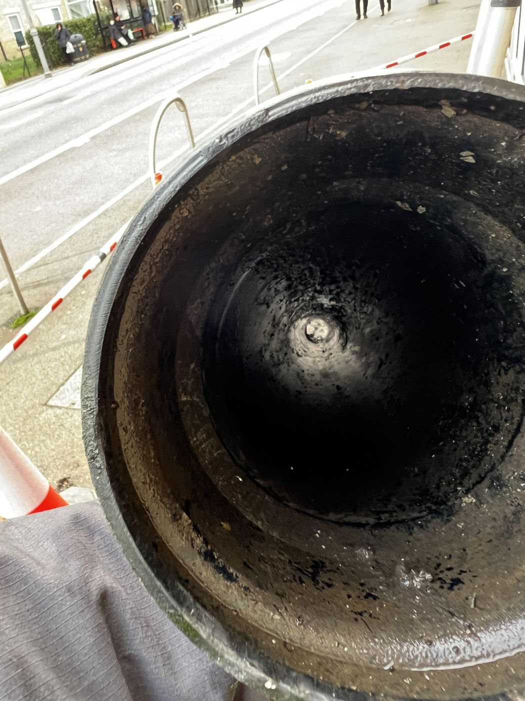 Cleared cast iron hopper head with the outlet visible at the base